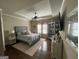 Large bedroom with tray ceiling, a ceiling fan, and abundant natural light at 2220 Cambridge Hill Ct, Dacula, GA 30019