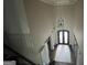 Beautiful two story foyer with hardwood floors, neutral walls, and an elegant chandelier at 2220 Cambridge Hill Ct, Dacula, GA 30019