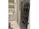 Convenient laundry room with modern washer/dryer and storage, designed for efficient organization at 2220 Cambridge Hill Ct, Dacula, GA 30019