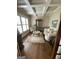 Cozy living room with coffered ceilings, beautiful hardwood floors, and an abundance of natural light at 2220 Cambridge Hill Ct, Dacula, GA 30019