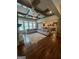 Open-concept living space with coffered ceilings, stone fireplace, and seamless flow to the kitchen at 2220 Cambridge Hill Ct, Dacula, GA 30019