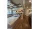 Large living area with coffered ceilings, fireplace, and an open layout connecting to the kitchen at 2220 Cambridge Hill Ct, Dacula, GA 30019