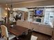 Open-concept living area featuring a stone fireplace, built-in shelving, and hardwood floors at 2220 Cambridge Hill Ct, Dacula, GA 30019