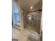 This main bathroom boasts a glass shower stall and a large soaking tub at 2220 Cambridge Hill Ct, Dacula, GA 30019