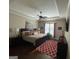 Main bedroom showcasing a trey ceiling, bright window, and stylish decor at 2220 Cambridge Hill Ct, Dacula, GA 30019