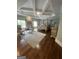This main bedroom features hardwood floors, large rug, trey ceiling and abundant natural light at 2220 Cambridge Hill Ct, Dacula, GA 30019