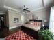 Spacious main bedroom with wood floors, colorful decor, and a tray ceiling at 2220 Cambridge Hill Ct, Dacula, GA 30019