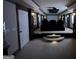 This theater room with projector and tiered seating is designed for immersive entertainment, with decorative columns and lighting at 2220 Cambridge Hill Ct, Dacula, GA 30019