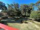 Lush backyard featuring mature trees and manicured lawn, perfect for outdoor activities at 363 Seminole Drs, Marietta, GA 30060