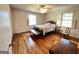 Bedroom with hardwood floors, ceiling fan, two windows, and furniture at 363 Seminole Drs, Marietta, GA 30060