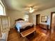 Cozy bedroom features hardwood floors, neutral walls, and a classic wooden bed frame at 363 Seminole Drs, Marietta, GA 30060