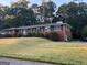 Charming brick home featuring a well-manicured lawn and mature shrubbery at 363 Seminole Drs, Marietta, GA 30060
