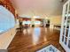 Open living room with wood floors, ample windows with natural light, and multiple ceiling fans at 363 Seminole Drs, Marietta, GA 30060