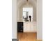 Stylish bar area with white cabinetry, a mini-fridge, and decorative archway at 490 Mount Paran Rd, Atlanta, GA 30327