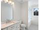 Bright bathroom with a tub and shower, marble countertops, white cabinets, and modern fixtures at 490 Mount Paran Rd, Atlanta, GA 30327