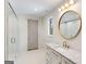 Elegant bathroom with a glass shower, marble countertop, and round mirror at 490 Mount Paran Rd, Atlanta, GA 30327