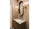 Elegant powder room with a marble sink and vanity at 490 Mount Paran Rd, Atlanta, GA 30327