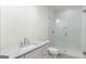 Modern bathroom with marble countertop, glass shower, and neutral color palette at 490 Mount Paran Rd, Atlanta, GA 30327