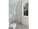 Modern bathroom with a frameless glass shower door and hexagon tile walls at 490 Mount Paran Rd, Atlanta, GA 30327