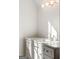 Bright bathroom vanity featuring a marble countertop and stylish lighting fixture at 490 Mount Paran Rd, Atlanta, GA 30327