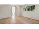 Spacious room features hardwood floors, neutral walls, and a window overlooking a backyard at 490 Mount Paran Rd, Atlanta, GA 30327