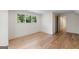 Well-lit room features hardwood floors, a large window, and a neutral color scheme at 490 Mount Paran Rd, Atlanta, GA 30327