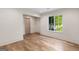 Well-lit bonus room featuring natural light, neutral walls, and hardwood floors at 490 Mount Paran Rd, Atlanta, GA 30327