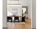 Inviting dining room with a modern chandelier, dining table, and view to the bar at 490 Mount Paran Rd, Atlanta, GA 30327