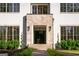 Close up featuring a stone accented entryway with a modern black door at 490 Mount Paran Rd, Atlanta, GA 30327