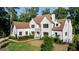 Beautiful two-story home featuring a manicured lawn, and well-maintained landscaping at 490 Mount Paran Rd, Atlanta, GA 30327