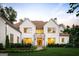 Stunning two-story home with a manicured lawn and a stone accent entryway at 490 Mount Paran Rd, Atlanta, GA 30327