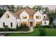 Beautifully landscaped home with a manicured lawn, stone accents, and inviting entrance at 490 Mount Paran Rd, Atlanta, GA 30327
