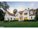 Beautifully landscaped home with a manicured lawn, stone accents, and inviting entrance at 490 Mount Paran Rd, Atlanta, GA 30327