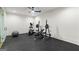 Bright home gym features exercise equipment and a rubber floor for comfortable workouts at 490 Mount Paran Rd, Atlanta, GA 30327