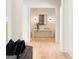 Bright hallway with console table, decor and sconces at 490 Mount Paran Rd, Atlanta, GA 30327