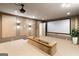 Entertainment room features a projector, large screen, stylish sconces, and comfortable seating at 490 Mount Paran Rd, Atlanta, GA 30327