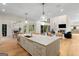 Open kitchen featuring a large island, modern appliances, and a view of the living area at 490 Mount Paran Rd, Atlanta, GA 30327