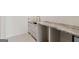 Unfinished kitchenette features stone countertops and white cabinets, ready for customization at 490 Mount Paran Rd, Atlanta, GA 30327
