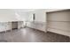 Modern laundry room featuring sleek cabinets, granite countertops, sink, and gray tile floors at 490 Mount Paran Rd, Atlanta, GA 30327