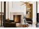 Bright living room featuring a fireplace, modern lighting, and cozy seating at 490 Mount Paran Rd, Atlanta, GA 30327