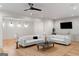 An elegant living room showcasing hardwood floors, recessed lighting, and comfortable seating with a stylish coffee table at 490 Mount Paran Rd, Atlanta, GA 30327