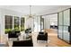 Bright living room with modern light fixture, glass doors and hardwood floors at 490 Mount Paran Rd, Atlanta, GA 30327