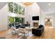 Spacious living room features hardwood floors, fireplace, deck access and abundant natural light at 490 Mount Paran Rd, Atlanta, GA 30327