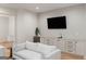 A refined living room featuring custom cabinets, a convenient beverage fridge, and a cozy seating arrangement at 490 Mount Paran Rd, Atlanta, GA 30327