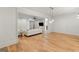 Spacious living area showcasing hardwood floors, open layout, and modern lighting with adjacent rooms visible at 490 Mount Paran Rd, Atlanta, GA 30327