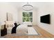Bright main bedroom with a sitting area, large window and chandelier lighting at 490 Mount Paran Rd, Atlanta, GA 30327