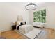 Bright main bedroom with a sitting area, large window and chandelier lighting at 490 Mount Paran Rd, Atlanta, GA 30327