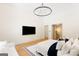 Bright main bedroom with ensuite bathroom access, television and chandelier lighting at 490 Mount Paran Rd, Atlanta, GA 30327