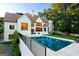 Spacious backyard featuring a large in-ground pool, patio, and lush landscaping at 490 Mount Paran Rd, Atlanta, GA 30327