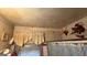 Outdated bathroom featuring floral wallpaper, a shower curtain, and damaged ceilings at 2234 Glendale Dr, Decatur, GA 30032